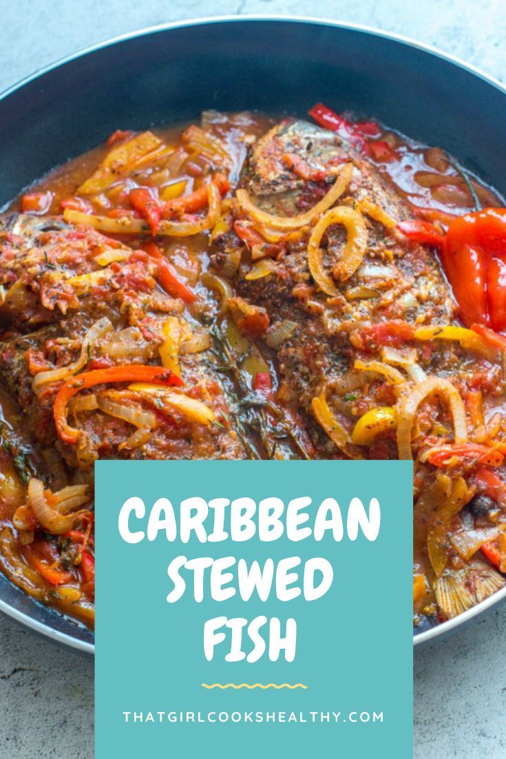 a pan filled with cooked fish and vegetables on top of a blue plate next to the words, carib bean stew fish