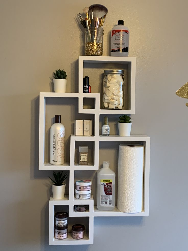 a white shelf filled with lots of different items