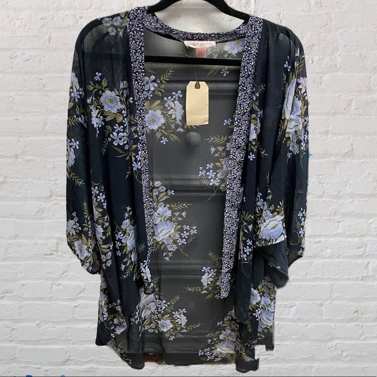 New With Tags!! Band Of Gypsies Navy Blue Floral Kimono With Paisley Print Boarder Size Xs/S - Runs Oversized Perfect For A Beach Coverup Or To Throw Over Jean/Shorts And Tank Top. Can Be Dressed Up Or Down Hi-Low Cut With Bell Like Elbow Length Sleeves 100% Polyester Approx Measurements: Pit To Pit - 28” Length - Front 29” & Back - 37” Comes From Clean, Smoke Free Environment Feel Free To Ask Any Questions! Casual Open Front Tops For Festival, Blue Bohemian Tops For Loungewear, Bohemian Blue Tops For Loungewear, Bohemian Blue Top For Loungewear, Blue Open Front Top For Spring, Spring Blue Tops One Size, Bohemian Blue Open Front Top, One Size Blue Floral Print Kimono, Blue Floral Print Long Sleeve Kimono