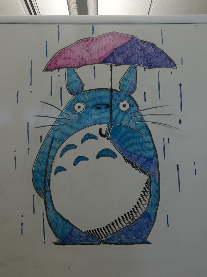 a drawing of a totoro holding an umbrella