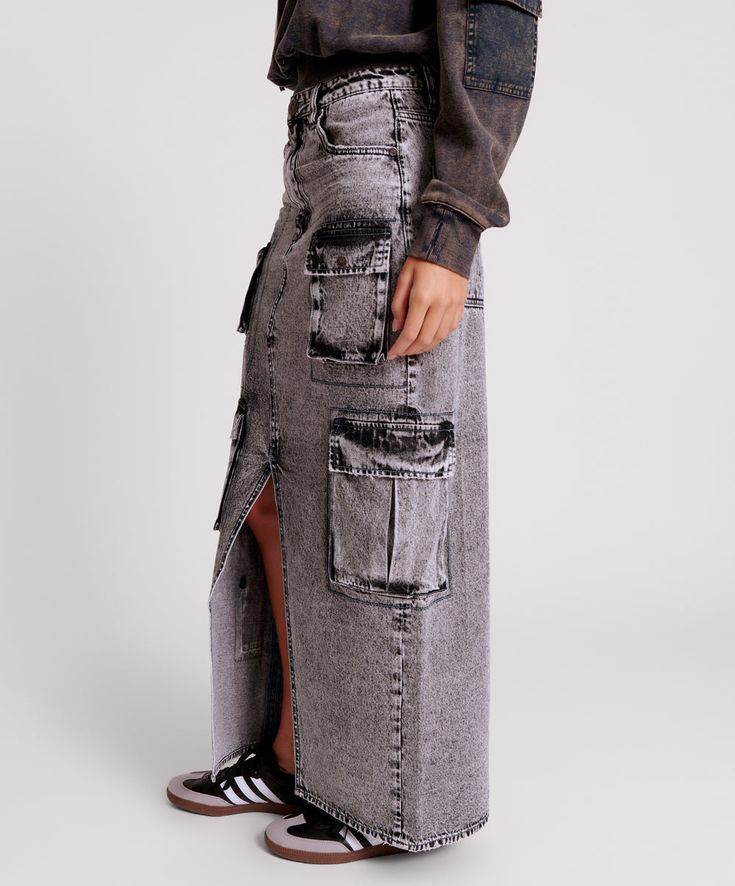 The SLATE ACID 90S CARGO POCKET COLUMN DENIM SKIRT is the ultimate action skirt. A long length column skirt, front split featuring a plethora of pockets for all your trinkets.  SLATE ACID is a 90s inspired black denim acid washed to perfection. Model wears a size 26 (size 4 USA or size 8 UK/AUSTRALIA). Dark Wash Denim Cargo Skirt With Pockets, High-waisted Medium Wash Denim Skirt For Streetwear, Long Denim Shorts Outfit, Relaxed Knee-length Denim Skirt With Pockets, Distressed High-rise Dark Wash Denim Skirt, Denim Skirts Online, Cotton Denim Skirt With Pockets, Medium Wash, High Waisted Jean Skirt, Long Denim Shorts