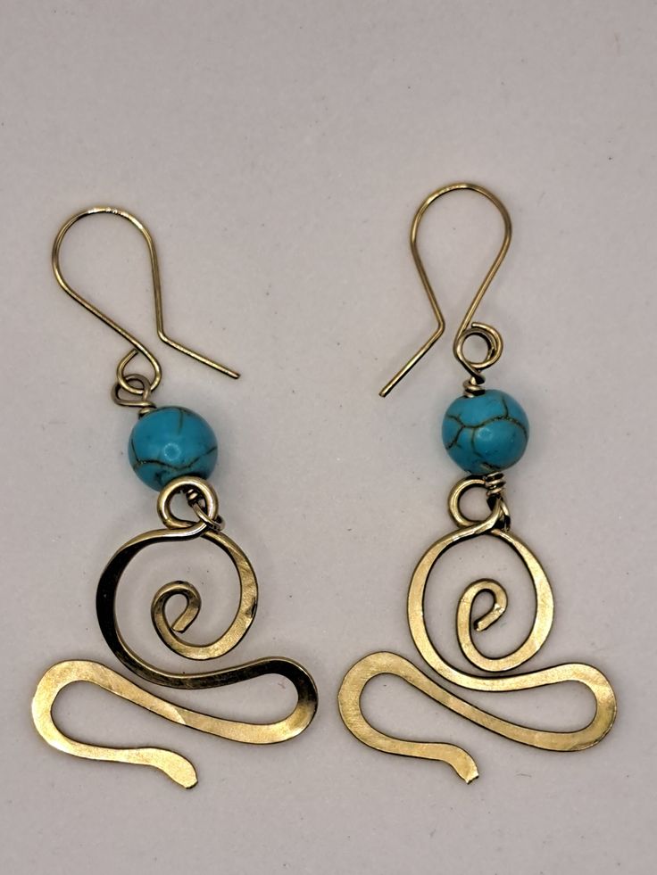 Handmade earrings to showcase those beautiful ears.    This pair of earrings also makes a great gift for anyone that wants to accessorize.  Made from Alpaca Nickel silver. Processing time: 1 - 2 days Shipping Time: 1-2 days Section/Category: Earrings, Jewelry, Accessories Handmade Turquoise Metal Chandelier Earrings, Unique Turquoise Metal Earrings, Elegant Handmade Turquoise Hoop Earrings, Handmade Turquoise Brass Earrings, Gift Turquoise Brass Earrings, Turquoise Brass Earrings As Gift, Turquoise Metal Earrings, Turquoise Brass Earrings For Gift, Bronze Wire Wrapped Earrings