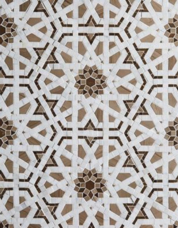 an intricately designed wall with brown and white tiles