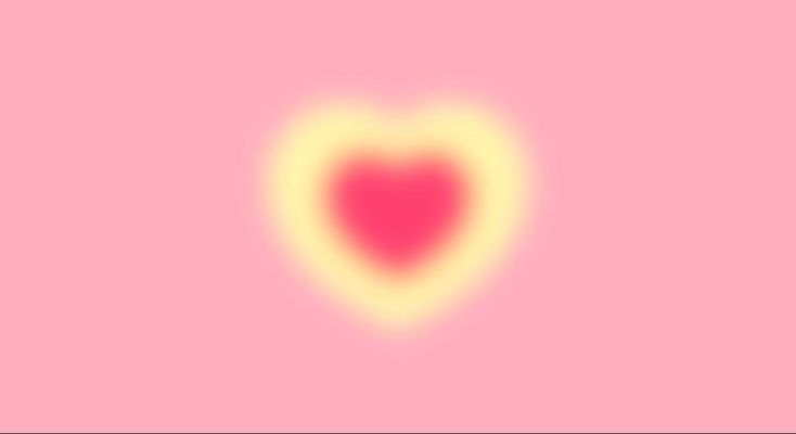 a pink and yellow heart on a pink background