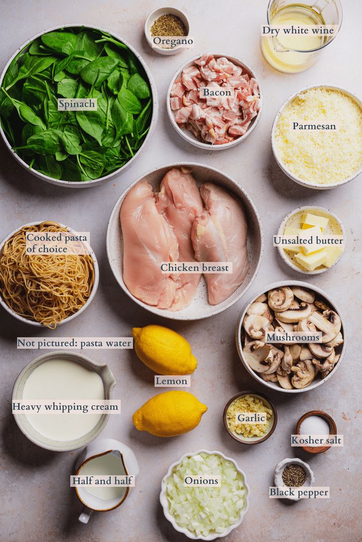 ingredients to make chicken broth laid out in bowls on a white surface with names