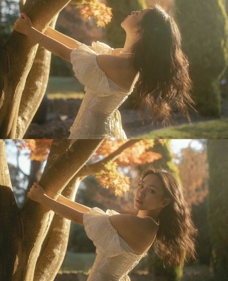 a woman in white dress leaning up against a tree