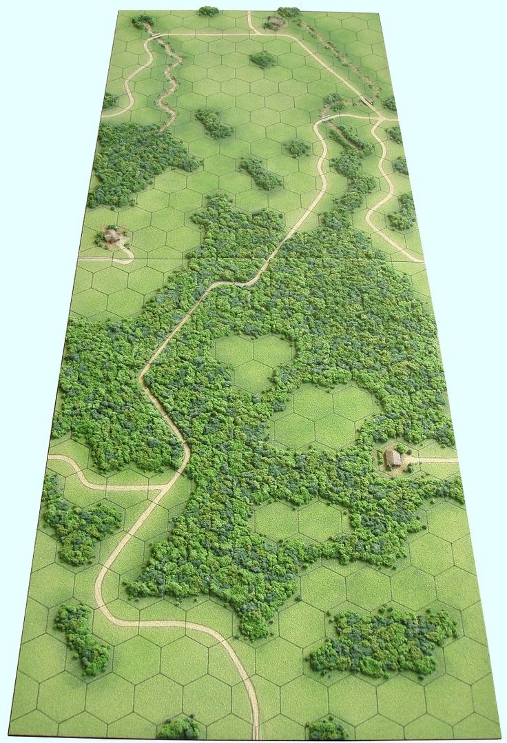 an aerial view of a green area with trees and bushes on the ground, including roads