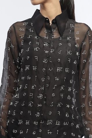 Black button down shirt with myriad script symbol embroidery in zardosi. - Aza Fashions Designer Embroidered Black Shirt, Designer Black Embroidered Shirt, Designer Long Sleeve Festive Shirt, Elegant Black Festive Shirt, Designer Black Tops For Festive Season, Designer Black Tops For Festive Occasions, Designer Embroidered Tops For Formal Occasions, Black Embroidered Silk Top, Black Button Down Shirt