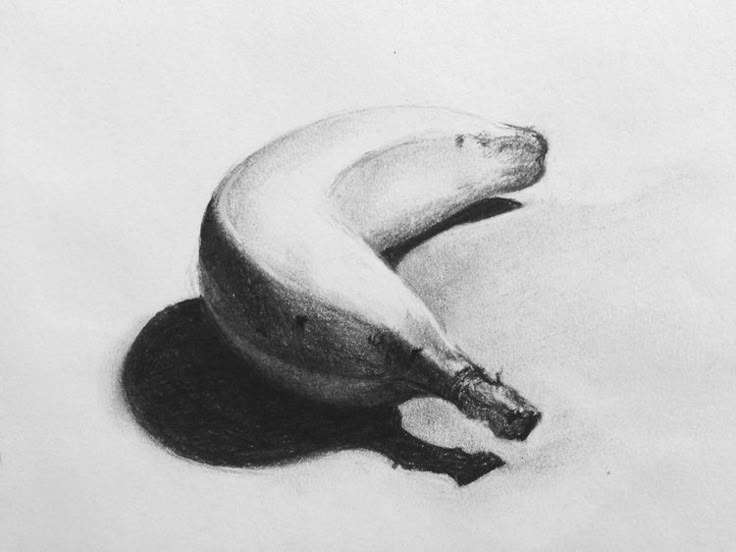 a pencil drawing of a banana sitting on the ground