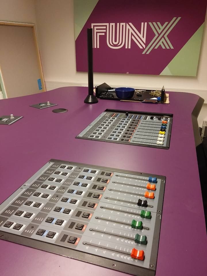 there is a sound board on top of the table in front of a sign that says funx