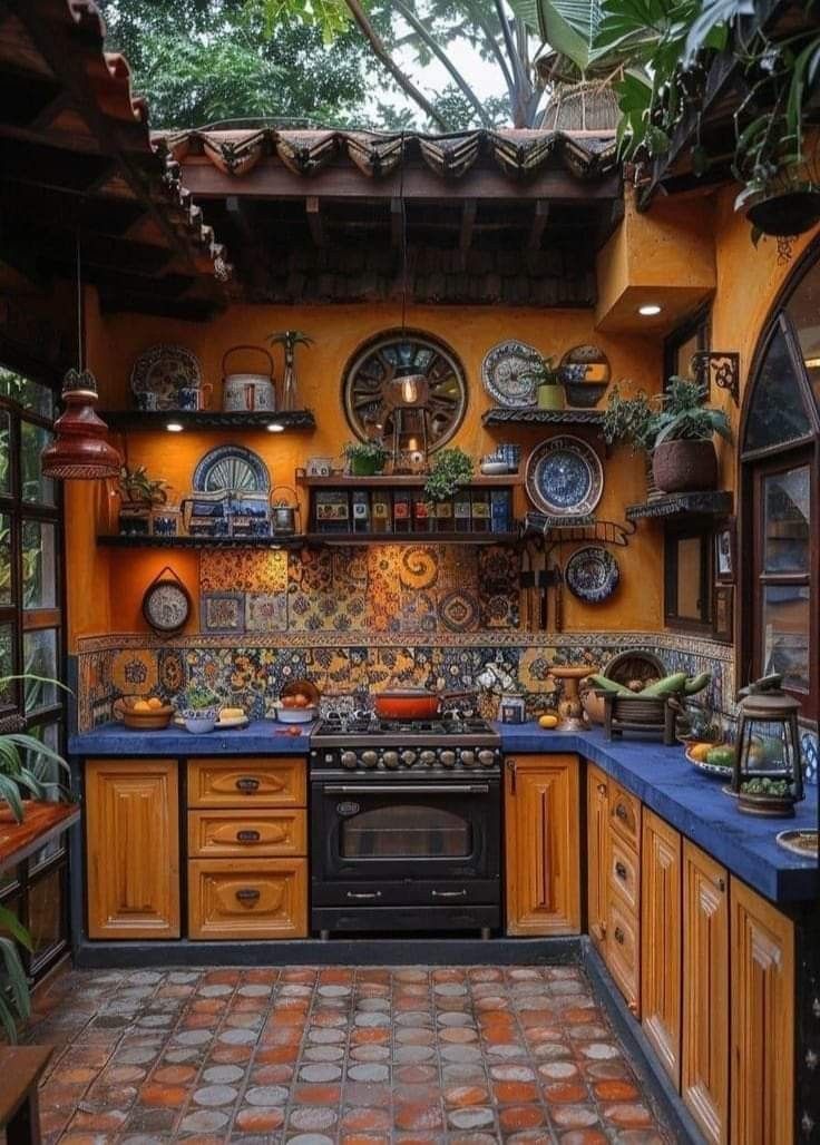 a kitchen with an oven, sink and counter tops in it's center area