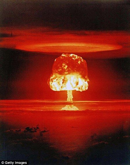 a nuclear mushroom is shown in the dark with red and black clouds behind it,