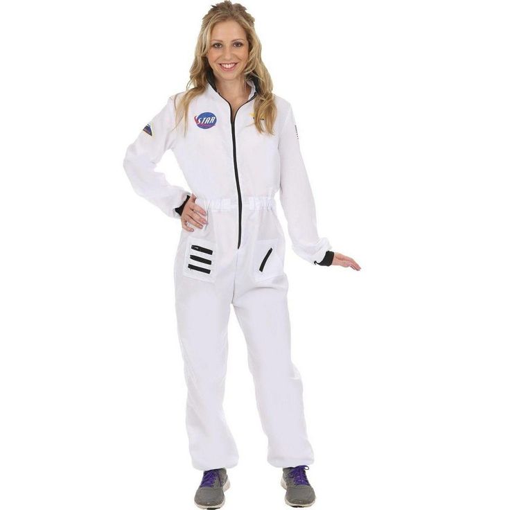 a woman in a white space suit is posing for the camera with her hands on her hips