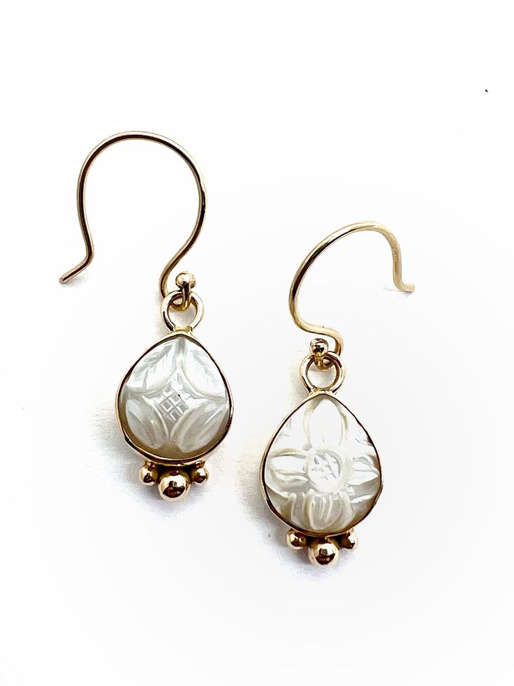 "Carved Freshwater Pearls set in 14k gold with 14k gold balls on a sterling silver backplate, these dainty earrings measure 3/4\" long including the loop at the top. The carved freshwater pearls are 1/2\" long by 3/8\" wide and although they are slightly mismatched in their carvings, they are the same size and shape.  They are available with 14k gold French wires, sterling silver French wires or sterling silver latch backs. These earrings are lightweight and so are very comfortable to wear all day and into the evening. These earrings will arrive in a beautiful gift box with a polishing cloth. Like all my jewelry, they come with a lifetime warranty. If they ever need a repair, just send them to me and I will fix them and return them to you at no charge. Free gift wrapping is available, just 14k Gold Silver Earrings With Rose Cut Diamonds, Elegant Oval Engraved Earrings, Elegant Engraved 14k Gold Earrings, Silver Earrings With Rose Cut Diamonds In 14k Gold, Silver 14k Gold Earrings With Rose Cut Diamonds, 14k Yellow Gold Teardrop Pearl Earrings, Gold Bridal Earrings With Rose Cut Diamonds, 14k White Gold Earrings With Rose Cut Diamonds, White Gold 14k Rose Cut Diamond Earrings