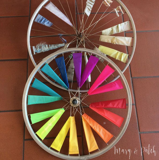 two wheel spokes with colored ribbons attached to them