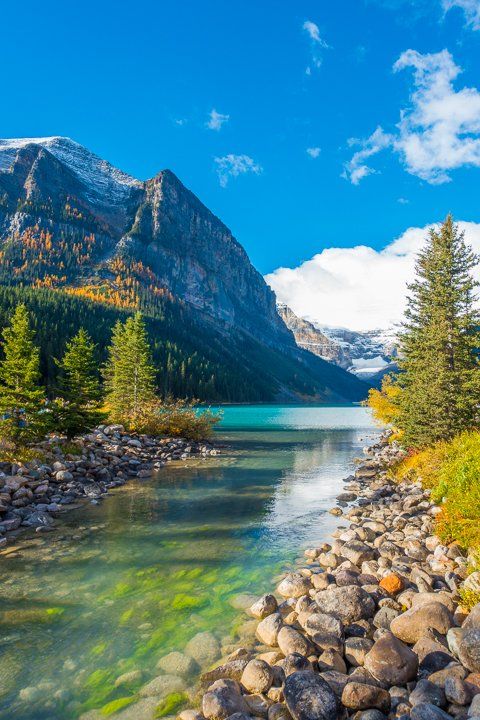 a mountain lake surrounded by trees and rocks