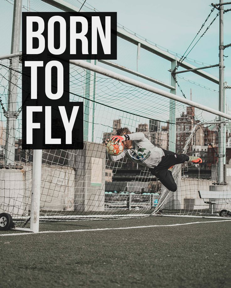 a soccer goalie catching a ball with the words born to fly in front of him