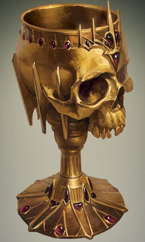 a golden cup with a skull on it's head and jewels around its neck