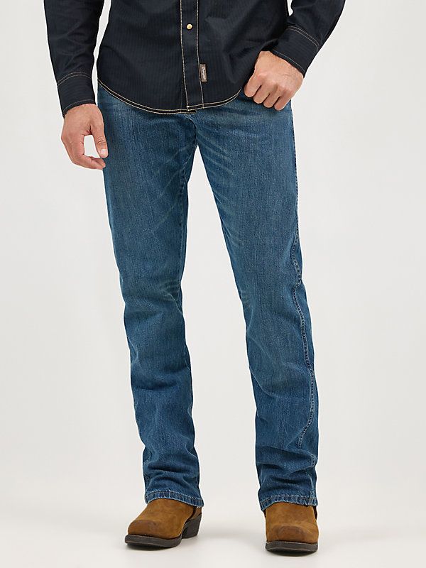 COMFORTABLE, CLASSIC, AND A LITTLE COUNTRY Wrangler® Retro® jeans are a modern take on our authentically Western jeans. Made for country rock stars, rodeo ropers, and those who just happen to have great taste, our men's retro bootcut jeans are a versatile style made to suit any occasion. They offer a comfortable mid rise, relaxed fit through the seat and thigh, and a leg opening that fits perfectly over your favorite pair of boots. Speaking to our Western heritage with a modern sensibility, our Medium Wash Denim Jeans For Ranch, Straight Leg Denim Jeans For Ranch, Denim Jeans For Ranch Activities In Fall, Western Style Mid-rise Denim Jeans, Fitted Denim Jeans For Rodeo, Straight Leg Jeans For Rodeo In Fall, Western Style Dark Wash Jeans For Fall, Fitted Western Denim Jeans, Western Dark Wash Jeans For Fall