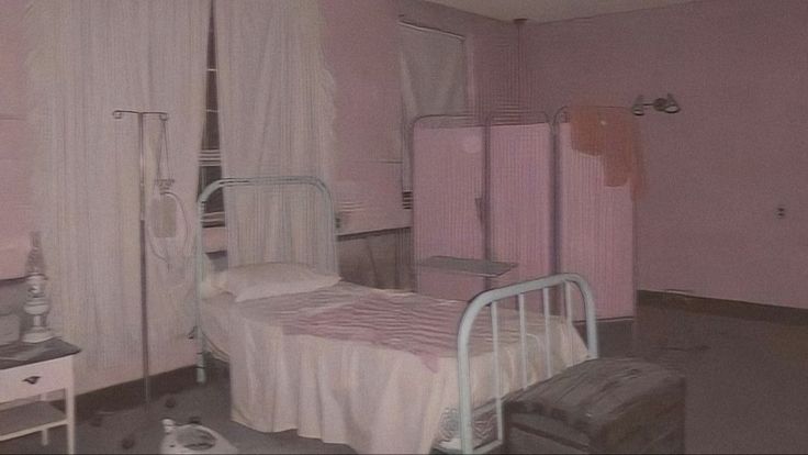 a bedroom with pink walls and white curtains