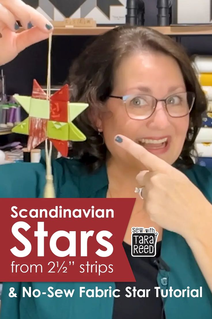 a woman in glasses pointing at a star ornament with the words scandinavian stars from 2 / 4 strips and no - sew fabric star tutors