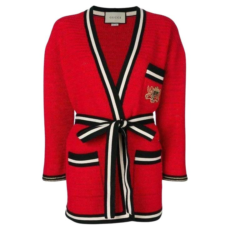 This red striped hem cardigan-coat is crafted from a cotton blend Deep V neck Long sleeves Belted waist Striped hem Logo chest pocket and front patch pockets. Black and cream ribbed hems. Composition: Cotton 55%, Polyamide 45% Trimming: 54% Metallised fiber, 46% polyamid Designer Style ID: 519840X9T02 Made in Italy Gucci Cardigan, Velvet Coat, Knitted Tops, Cardigan Long, Black And Cream, Striped Cardigan, Shearling Jacket, Cardigan Coat, Sweater Outfits