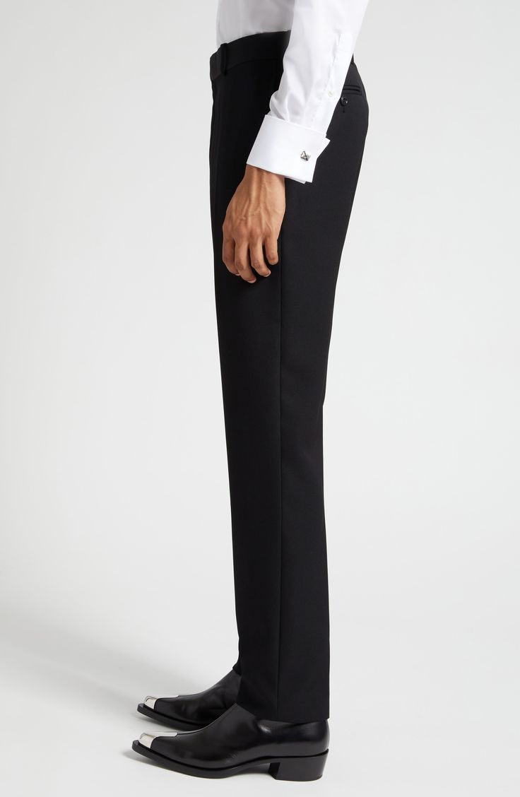 Tailored elegance pervades Italian-crafted trousers fashioned from smooth wool with cleanly pressed creases and a flat front. 34" unhemmed inseam; 14" leg opening; 11 1/2" front rise; 15 1/2" back rise (size 48 EU) Zip fly with hook-and-bar closure 100% wool Dry clean Made in Italy Men's Designer Clothing Luxury Tapered Leg Dress Pants For Semi-formal Occasions, Luxury Straight Leg Dress Pants For Semi-formal Occasions, Elegant Suiting Fabric Dress Pants With Flat Front, Elegant Flat Front Dress Pants In Suiting Fabric, Formal Slim Fit Wool Bottoms, Formal Slim Fit Suiting Fabric Pants, Tailored Evening Suit With Straight Pants, Tailored Wool Pants For Formal Occasions, Formal Slim Fit Pants In Suiting Fabric