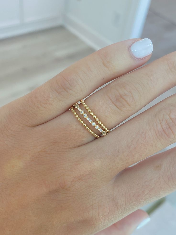 Add this delicate beaded design 14K gold band to any finger --- it is easiest ring to layer into your everyday jewelry routine! Dainty 14k Gold Stackable Rings, Dainty Stackable Yellow Gold Midi Rings, Dainty Stackable Bands, Dainty Yellow Gold Stackable Midi Rings, Delicate Hypoallergenic 14k Gold Midi Rings, Dainty Stackable Bands For Promise Ring, Dainty Stackable Eternity Band Ring, Everyday Stackable 14k Gold Eternity Band, Everyday 14k Gold Stackable Eternity Band