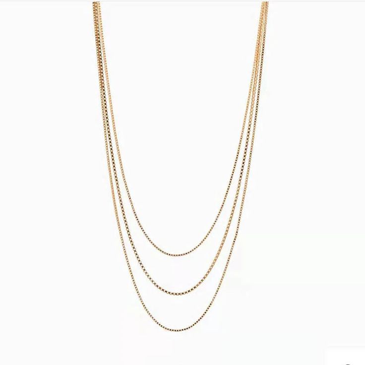 A dainty staple piece that everyone needs in their jewel collection. This hassle-free necklace is a triple layer created with only one clasp. Making this necklace the easiest way to stack your jewels with ease. 18K Gold-Plated Stainless Steel Nickel-Free Lead-Free Hypoallergenic 3-in-1 Necklace Lobster Clasp 14" 15" 16" Chains 2" Extender Water Resistant Dainty Bar Necklace, Anodized Aluminum Jewelry, Simple Chain Necklace, Dainty Pearl Necklace, Aluminum Jewelry, Gold Necklace Simple, Mens Gold Jewelry, Long Silver Necklace, Gold Cross Necklace