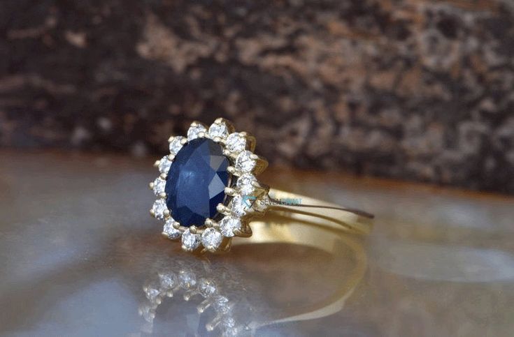 an oval shaped blue sapphire and diamond ring