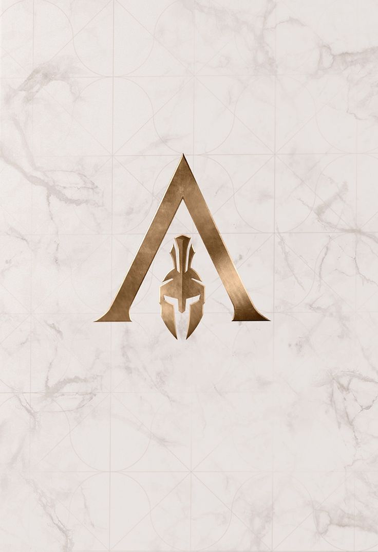 the letter a is made up of gold foil on a white marble background with an egyptian ornament