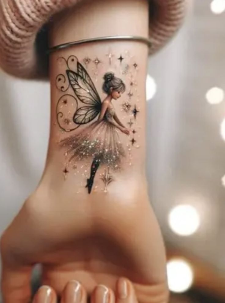 a woman's foot with a fairy tattoo on it