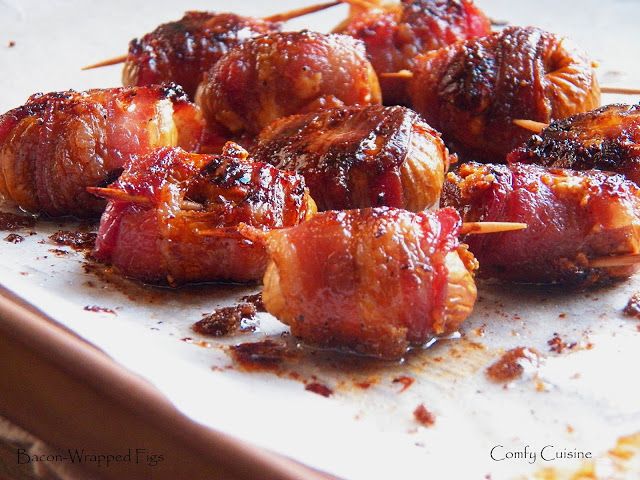 bacon wrapped skewers with toothpicks on a plate