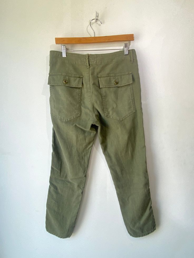 The Great Green Pants! Super soft cotton blend with a button fly and high rise waist. Made in USA. Marked a size 26, but fit larger, please refer to measurements. In excellent condition! Approx. Measurements: Waist: 32" Rise: 12" Inseam: 25" Khaki Cotton Cargo Pants With Button Closure, Casual Cotton Cargo Pants With Button Closure, Mid-rise Cotton Utility Bottoms, Green High Rise Cotton Pants, Relaxed Fit Cotton Cargo Pants With Button Closure, Cotton Trousers With Button Closure, Cotton Straight Leg Pants With Button Closure, Straight Leg Cotton Pants With Button Closure, Utility Cotton Bottoms With Button Closure