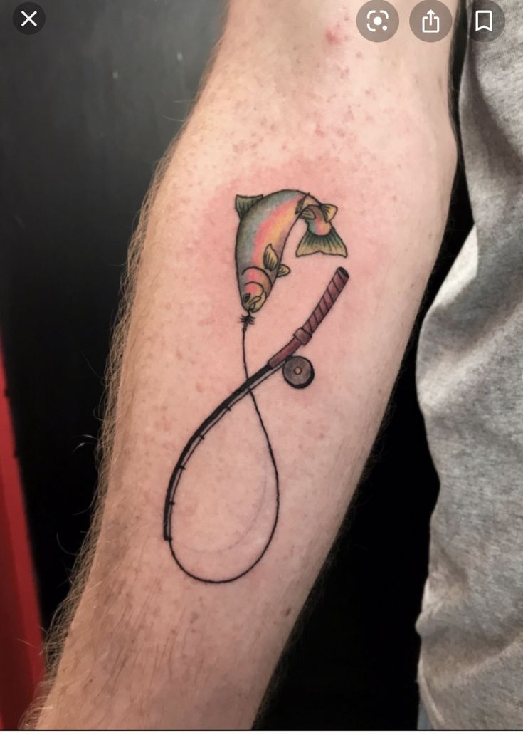 a man's arm with a tattoo on it that has an image of a fish hooked up to a fishing hook