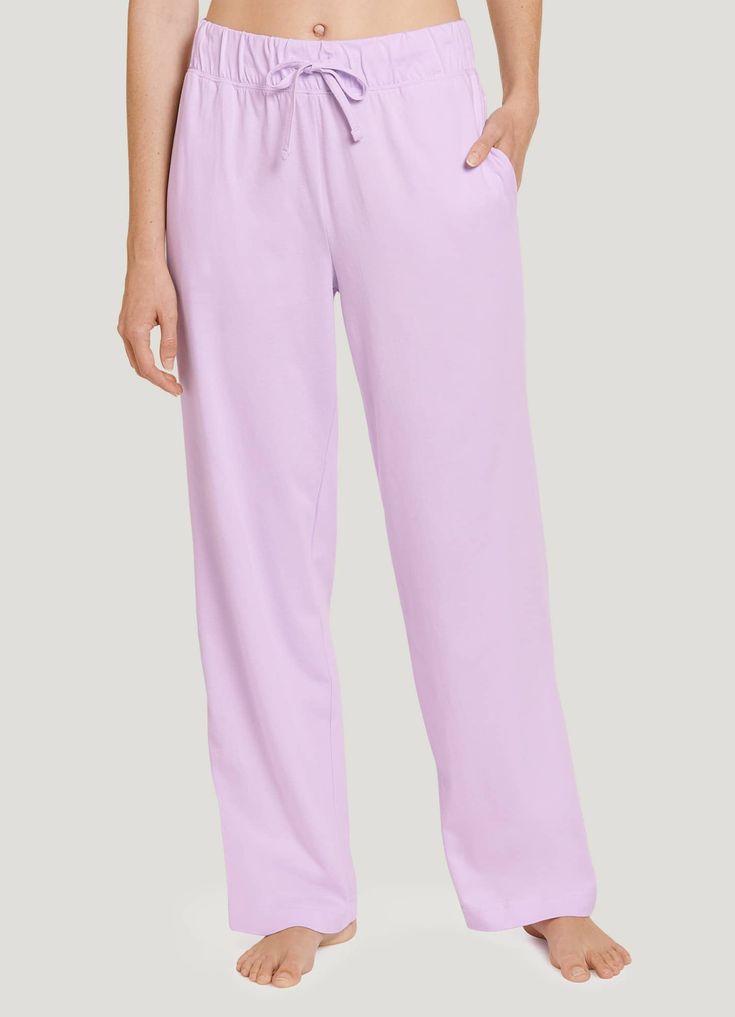 The Jockey® Everyday Essentials 100% Cotton Pant helps bring the joy of pure cotton to bedtime, lounge time, or any time your greatest desire is to be comfy and cozy. Adding to that comfort is an elastic waistband that stays flat as you move, with a drawstring that helps you find the right fit. But there's convenience, too - side pockets give you a spot to warm your hands or stash a phone! | Jockey® Everyday Essentials 100% Cotton Pants in Dewy Lilac Moisture-wicking Relaxed Fit Bottoms For Loungewear, Moisture-wicking Relaxed Fit Jogging Bottoms, 4-way Stretch Sweatpants With Elastic Waistband For Loungewear, Jogging Pants With 4-way Stretch And Comfort Waistband, Loungewear Joggers With 4-way Stretch And Comfort Waistband, Travel Collection, Everyday Essentials, Cotton Pants, Sleepwear Women