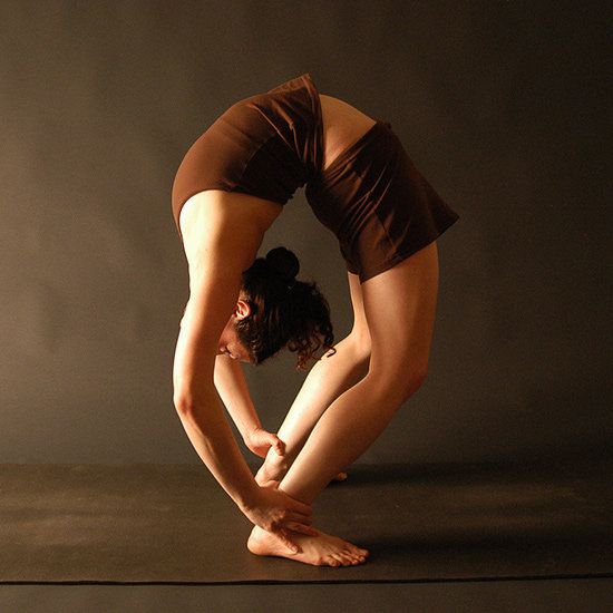 a woman doing yoga poses in front of a dark background