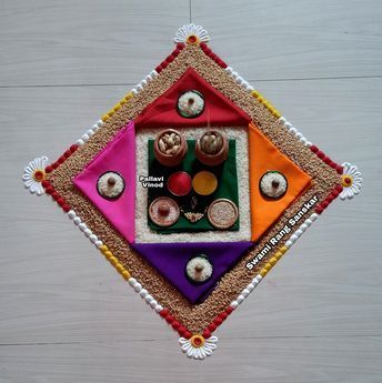 this is a decorative wall hanging made out of different colored materials and beads on wood planks