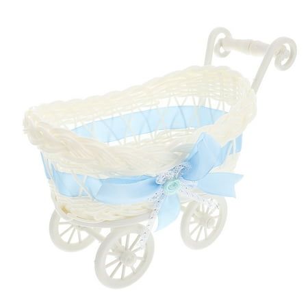 a white and blue baby's carriage with a bow