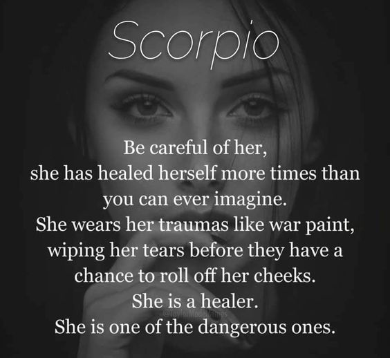 a woman's face with the words scorpio written on it and an image of