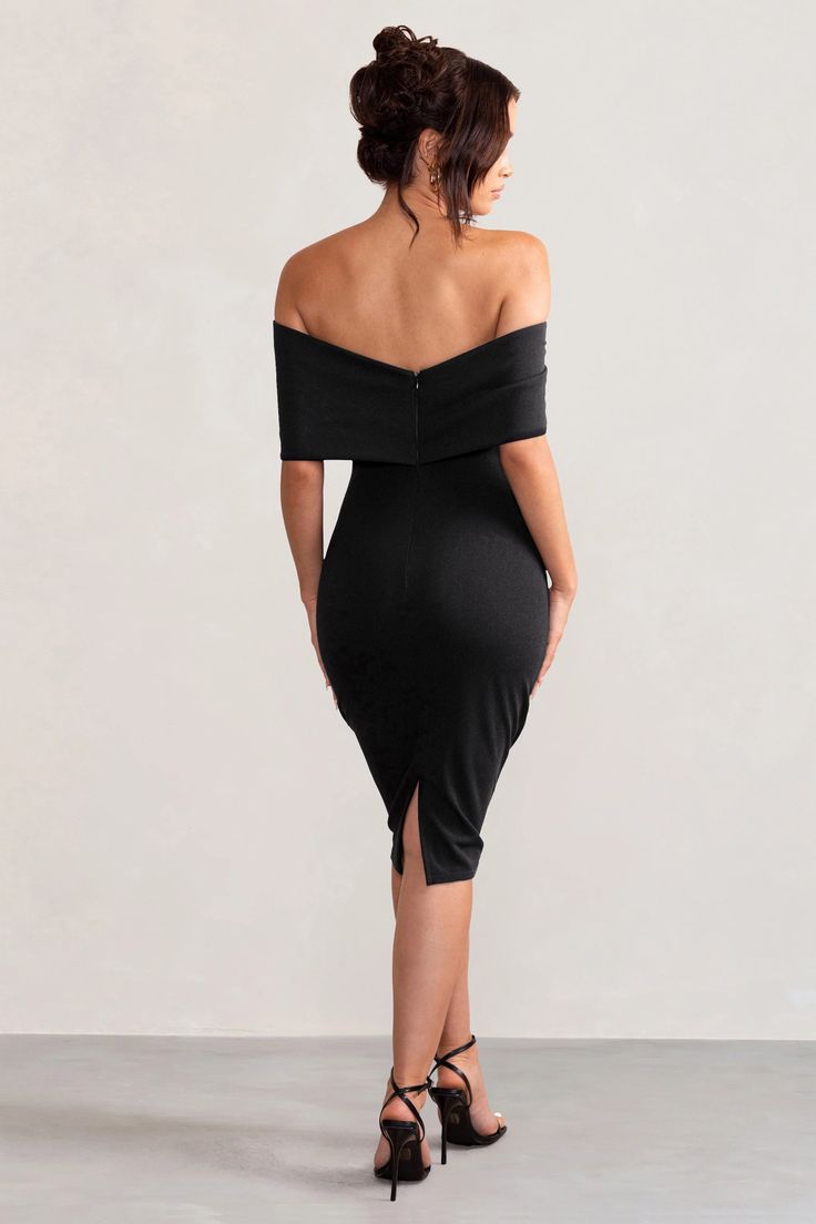 Meet Alyssa, our must-have midi dress made from a black scuba crepe that's both supportive and sculpting. Sure to turn heads at any formal event from birthdays to baby showers, this black bodycon dress features a Bardot neckline wrapped by a large bow and a split fitted skirt. Features - Premium scuba crepe - Bardot neckline - Large bow detail - Darted bodice - Bodycon fit - Invisible zip closure - Split hemline - Midi length Sizing & Fit Rona is 5’8' and wears UK size 8 / US size 4 Courtney is 5'10” and wears UK 16/ US 12 Product Information Designed exclusively at Club L London Good stretch Premium scuba crepe in Black (95% Polyester, 5% Elastane) 110cm total length SKU: CL127772002 We recommend buying a size down.