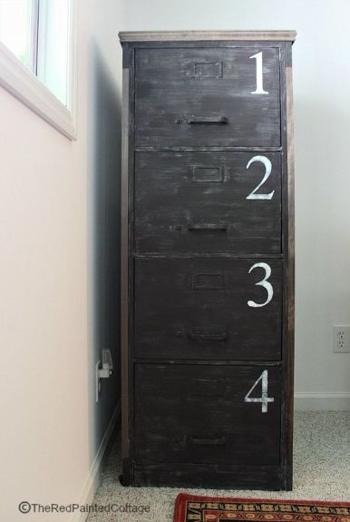 a tall wooden cabinet with numbers on the front and bottom, sitting next to a door