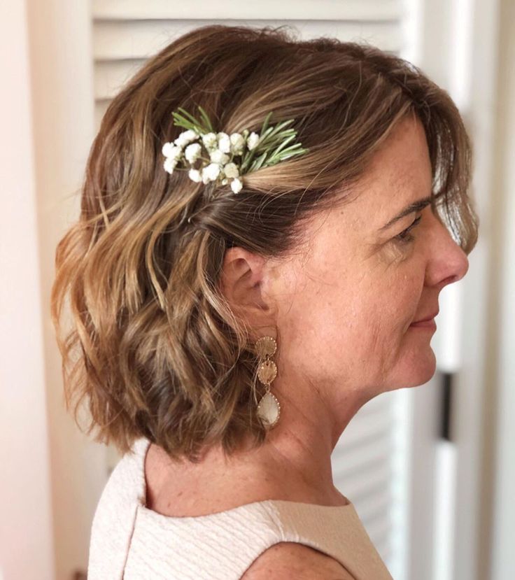 a woman wearing a flower in her hair