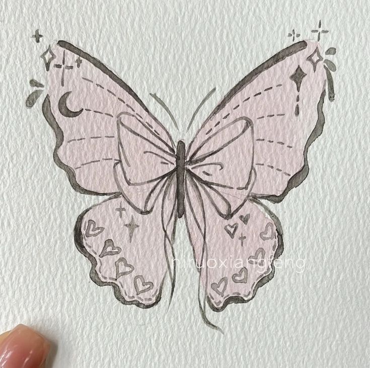 a drawing of a pink butterfly on white paper