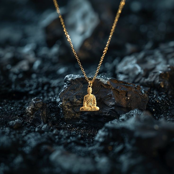 Find peace and enlightenment with our gold Buddha pendant, exquisitely crafted in the USA. Symbolizing serenity, wisdom, and spiritual awakening, each piece is a sanctuary of calm and reflection. PENDANT INFORMATIONThis pendant is made of real, solid gold.• Made in USA• Size: MINI• Height: 1" (25 mm) x Width: 0.72" (18 mm)• Pendant weight (approx.): 3 grams (14k)• Bail: fits up to 4 mm chains• Solid back, not hollow• A certificate of authenticity is included• Delivered in our elegant jewelry box Gold Buddha, White Gold Pendant, Buddha Pendant, Solid Gold Chains, Mini Pendants, Find Peace, Patron Saints, Memento Mori, Finding Peace