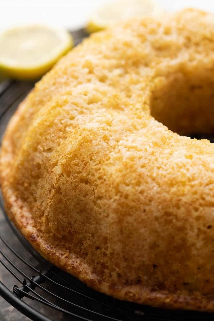 there is a lemon cake on the cooling rack