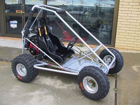 a go kart is parked in front of a store