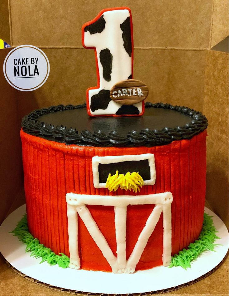 a cake made to look like a barnyard with a number one on top