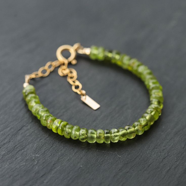 Want to save 15% off your first order? Sign up for our newsletter by visiting our website and filling out the pop up form. Receive a code by email, then send us that code through Etsy messages to save 15% off your ETSY order, sign up here: www.earthlyabundancejewelry.com  Peridot: heart chakra, willpower, surrender, clarity, happiness, moving forward D E T A I L S △ Handmade in Vancouver △ AAAA+ Peridot 5.5mm (roughly) △ Adjustable: fits roughly 6-8" △ 14K Gold filled clasp and extender  △ Gemstones are genuine  Q U A L I T Y  The upmost quality and care goes into sourcing each and every material I use. Gemstones are sourced from Jaipur and Rishikesh, India and I hold stronger connections to my suppliers. I use 100% authentic gemstones, this is our guarantee (no synthetics or imitation sto Peridot Bracelet, Gemstone Properties, Peridot Jewelry, Rishikesh, Gemstone Bracelets, Heart Chakra, Cotton Bag, Jewelry Care, Jaipur