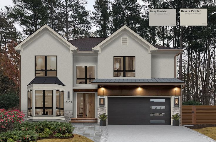 a large white house with lots of windows on it's front porch and garage